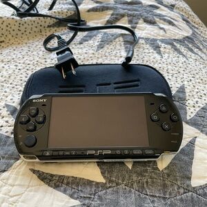 PSP with one game and charger
